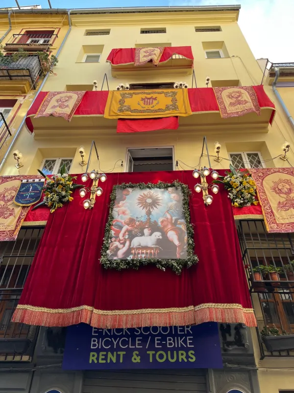 Colorful banners line the streets for the Corpus Christi procession in Valencia, Spain, June 11, 2023. Credit: Courtesy of Rachel Thomas
