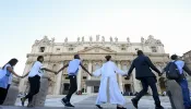 Young people from around the world held hands in St. Peter's Square during the #NotAlone human fraternity event June 10, 2023.